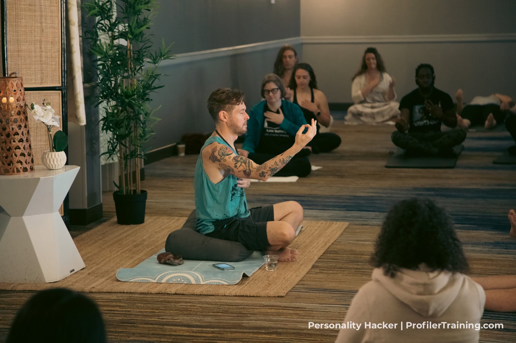 Dario leading an in-person body-mind workshop with participants